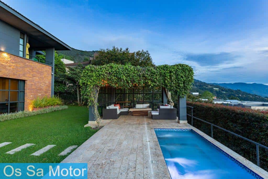 a house with a swimming pool in front of it